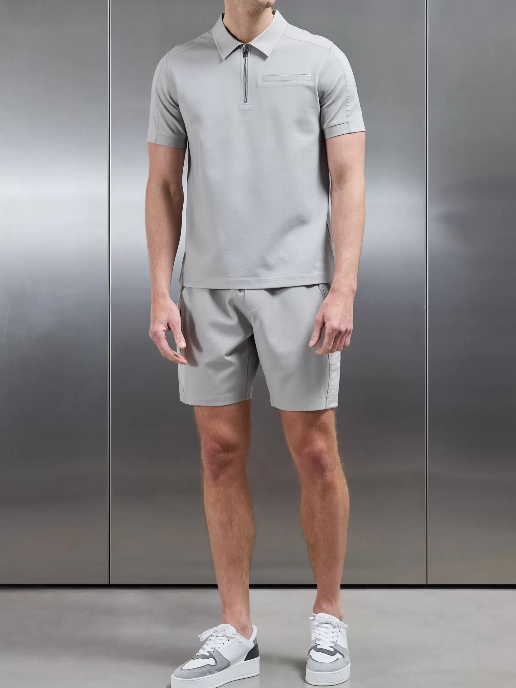 Shop ARNE Hybrid Cargo Zip Polo Shirt - Stone
